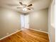 Second bedroom with hardwood floors and ceiling fan at 886 Kenton St, Aurora, CO 80010