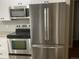 Updated kitchen with stainless steel appliances and granite countertops at 886 Kenton St, Aurora, CO 80010