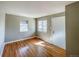 Bright living room with hardwood floors and large windows at 886 Kenton St, Aurora, CO 80010