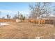 Expansive backyard featuring a shed, wooden fence, and potential for outdoor activities at 956 Racine St, Aurora, CO 80011