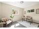 This staged room features a desk, chair and decor throughout the room at 956 Racine St, Aurora, CO 80011