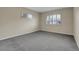 Empty bedroom offers plenty of natural light from windows with shutter blinds at 956 Racine St, Aurora, CO 80011