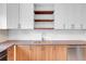 Modern kitchen features stainless steel appliances, butcher block countertops, and wood cabinets at 956 Racine St, Aurora, CO 80011