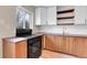 A black stove complements the butcher block counters, tile backsplash, and wood cabinets at 956 Racine St, Aurora, CO 80011