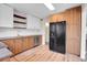Bright kitchen with white subway tile, butcher block counters, and wood cabinets at 956 Racine St, Aurora, CO 80011