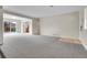 Expansive living room with ample natural light and neutral-colored walls at 956 Racine St, Aurora, CO 80011