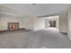 Spacious living room with a stone fireplace and neutral décor at 956 Racine St, Aurora, CO 80011