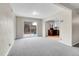 Cozy living room space with sliding glass doors to the backyard and view to kitchen at 956 Racine St, Aurora, CO 80011
