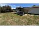 Spacious backyard featuring a covered patio, perfect for outdoor entertaining and relaxation at 2513 S Crystal St, Aurora, CO 80014