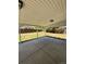 Covered patio with concrete flooring, offering a comfortable outdoor space overlooking the backyard at 2513 S Crystal St, Aurora, CO 80014