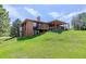 Spacious backyard with covered patio and deck provides ample space for outdoor enjoyment at 6155 Meadowbrook Dr, Morrison, CO 80465