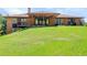 Expansive backyard features a covered patio, perfect for outdoor entertaining and relaxation at 6155 Meadowbrook Dr, Morrison, CO 80465
