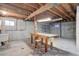Unfinished basement with exposed ceiling and concrete walls, ready for customization at 6155 Meadowbrook Dr, Morrison, CO 80465