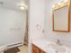 Bathroom featuring a white vanity, mirror, shower, and toilet at 6155 Meadowbrook Dr, Morrison, CO 80465
