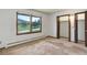 Bedroom featuring a large window with natural light and an empty closet at 6155 Meadowbrook Dr, Morrison, CO 80465