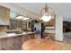 Cozy kitchen featuring wood cabinets, stainless steel appliances, and a breakfast bar area at 6155 Meadowbrook Dr, Morrison, CO 80465