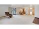 Open floorplan: living area featuring a dining table, recliner, and a sliding glass door to the outdoors at 6155 Meadowbrook Dr, Morrison, CO 80465
