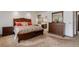 Main bedroom with a large bed, bedside tables, and a dresser with a mirror at 6155 Meadowbrook Dr, Morrison, CO 80465