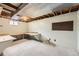Unfinished basement with desk and shelving is ready for your customization at 1497 S Oakland St, Aurora, CO 80012