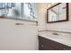 Bright bathroom with updated vanity and fixtures at 1497 S Oakland St, Aurora, CO 80012