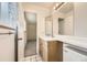 A bathroom featuring a modern sink with a cabinet and large mirror at 1497 S Oakland St, Aurora, CO 80012