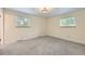 Bright, spacious bedroom with large windows and plush carpeting at 1497 S Oakland St, Aurora, CO 80012