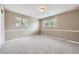 Bedroom featuring two large windows, plush carpeting, and neutral paint at 1497 S Oakland St, Aurora, CO 80012
