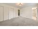 Spacious bedroom featuring plush carpeting, double closets, and ensuite bath at 1497 S Oakland St, Aurora, CO 80012