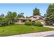 Traditional two-story home featuring a brick facade, attached two-car garage, and verdant front lawn at 1497 S Oakland St, Aurora, CO 80012