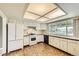 Classic kitchen featuring white appliances, ample counter space, and a bright, airy atmosphere at 1497 S Oakland St, Aurora, CO 80012