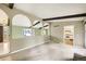 Inviting living room with archways, beams, and view into kitchen at 1497 S Oakland St, Aurora, CO 80012