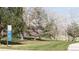 A neighborhood park is seen with lush green grass, walking path and playground beyond at 11068 Eudora Cir, Thornton, CO 80233