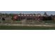 Exterior view of the recreation center with a waterslide and large windows overlooking a green field at 11068 Eudora Cir, Thornton, CO 80233