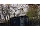 A small blue shed with surrounding trees at 11068 Eudora Cir, Thornton, CO 80233