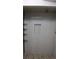 Bathroom shower with gray tile, recessed shelf and dark fixtures at 11068 Eudora Cir, Thornton, CO 80233