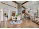 Elegant dining area featuring a stone fireplace, hardwood floors, and an open layout at 6371 Diamond Ridge Pkwy, Castle Rock, CO 80108