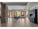 Open dining room with a stone pillar, tile flooring, and views of the outdoor patio at 6371 Diamond Ridge Pkwy, Castle Rock, CO 80108