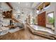 Grand entryway with a large wooden door, high ceilings, hardwood floors and lots of natural light at 6371 Diamond Ridge Pkwy, Castle Rock, CO 80108