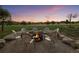 Inviting backyard fire pit area with comfortable seating, perfect for gathering and enjoying the outdoors at 6371 Diamond Ridge Pkwy, Castle Rock, CO 80108