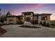Charming home showcasing its front exterior, landscaped circle drive, and basketball court at 6371 Diamond Ridge Pkwy, Castle Rock, CO 80108