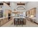 Bright kitchen features a large island, high-end appliances, and custom cabinetry at 6371 Diamond Ridge Pkwy, Castle Rock, CO 80108
