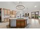 Gourmet kitchen with a large island, custom cabinetry, and stainless steel appliances at 6371 Diamond Ridge Pkwy, Castle Rock, CO 80108