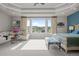 Bright main bedroom with large windows, a seating area, and scenic views at 6371 Diamond Ridge Pkwy, Castle Rock, CO 80108