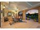 Inviting covered patio with stone accents and outdoor dining area, perfect for entertaining at 6371 Diamond Ridge Pkwy, Castle Rock, CO 80108