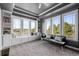 Cozy sitting area featuring large windows, built-in shelves, and stylish seating at 6371 Diamond Ridge Pkwy, Castle Rock, CO 80108