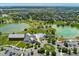 Community aerial view features a pool and clubhouse near winding walkways and ponds at 10550 Sedalia St, Commerce City, CO 80022