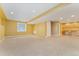 Finished basement area with carpeting and a window for natural light at 10550 Sedalia St, Commerce City, CO 80022