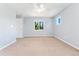 Bright bedroom with neutral carpet and ample natural light from the large window at 10550 Sedalia St, Commerce City, CO 80022