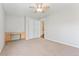 Bedroom featuring neutral carpet, a ceiling fan, and a built-in desk area at 10550 Sedalia St, Commerce City, CO 80022