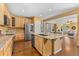 Gourmet kitchen with hardwood floors, stainless steel appliances, and ample cabinet space at 10550 Sedalia St, Commerce City, CO 80022